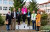 Biegacze stoją na podium